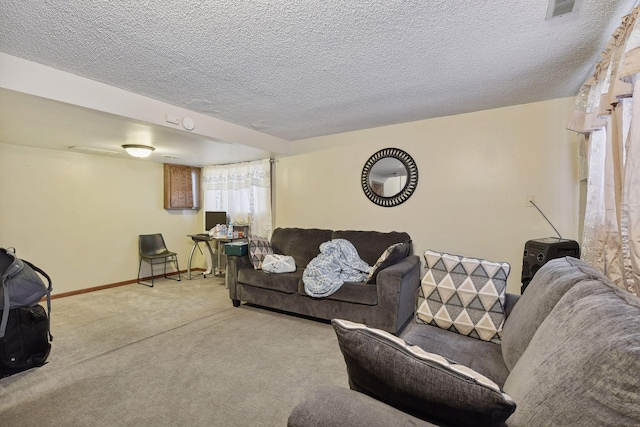 carpeted living room featuring a textured ceiling