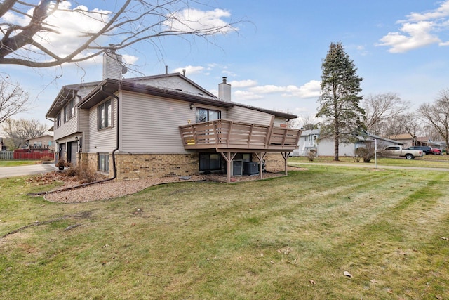 view of property exterior with a lawn, central air condition unit, a garage, and a deck