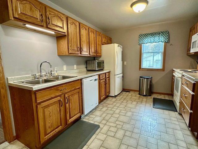 kitchen with white appliances and sink