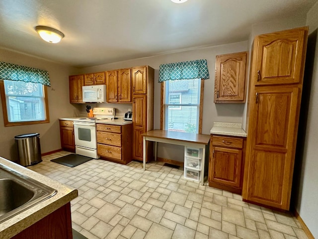 kitchen with white appliances and sink