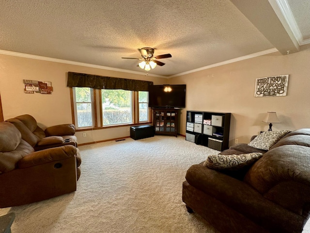 living room featuring carpet flooring, ceiling fan, ornamental molding, and a textured ceiling