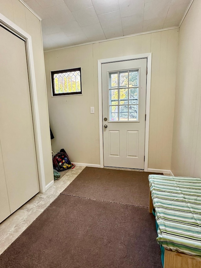 entryway with carpet flooring