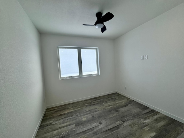 unfurnished room with ceiling fan and dark hardwood / wood-style floors