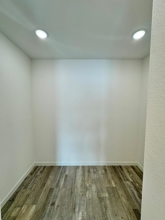 unfurnished room with hardwood / wood-style flooring