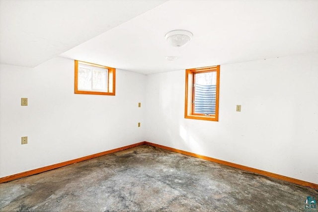 unfurnished room featuring concrete floors