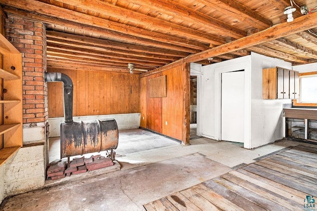 basement featuring a wood stove