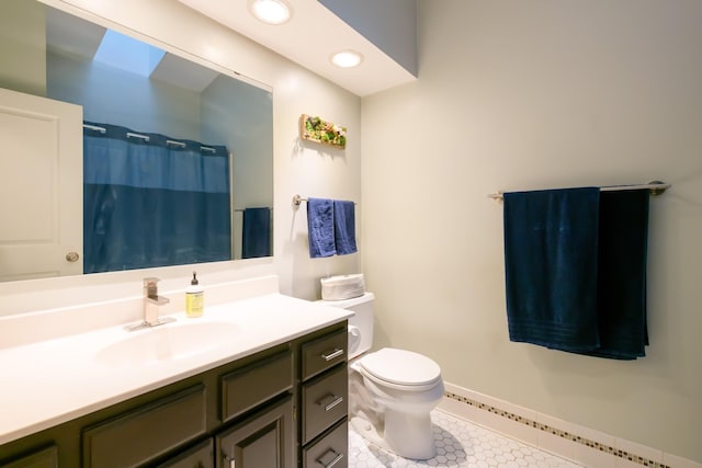 bathroom with tile patterned floors, vanity, curtained shower, toilet, and recessed lighting