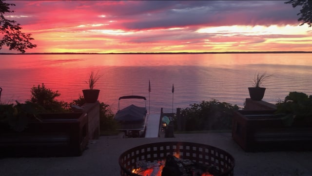 property view of water with a fire pit