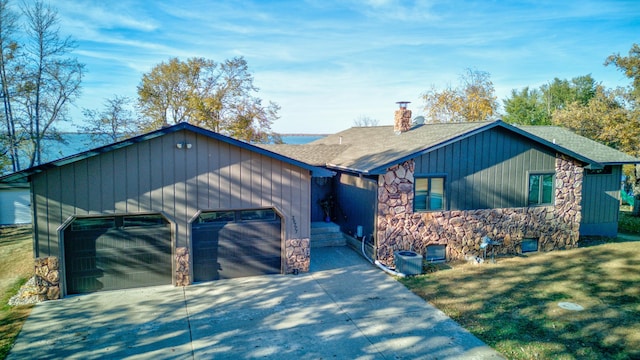 view of front of house with a front yard and a garage