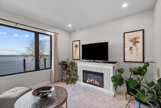 living room featuring a water view