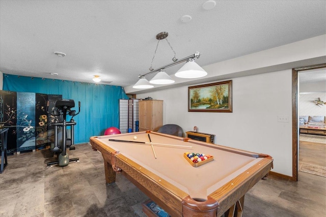 rec room featuring a textured ceiling, billiards, and concrete flooring