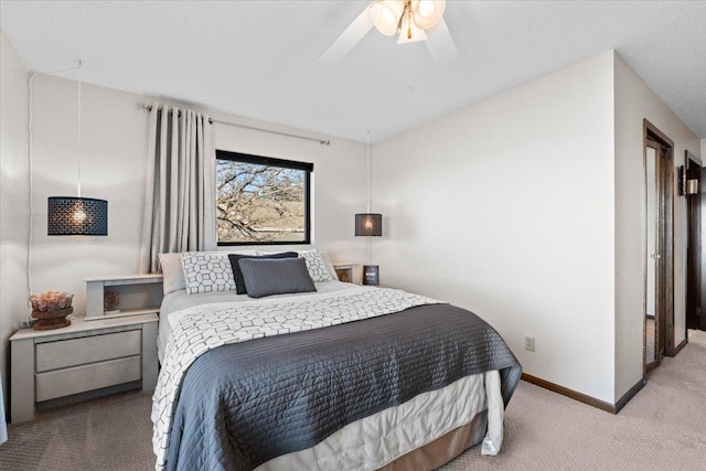 bedroom featuring baseboards, carpet, and ceiling fan