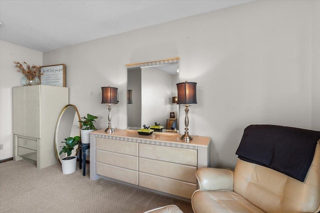 sitting room featuring light colored carpet