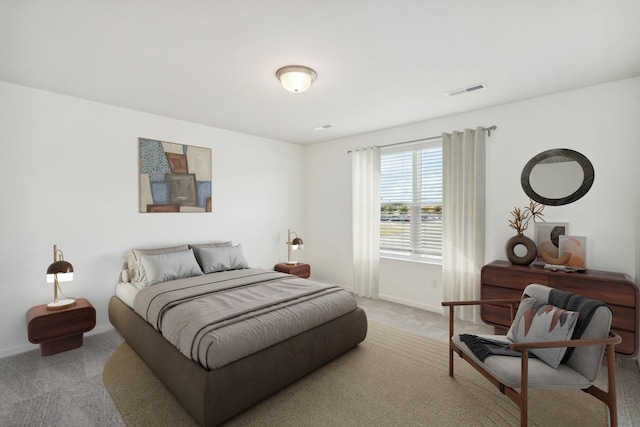 bedroom featuring light colored carpet