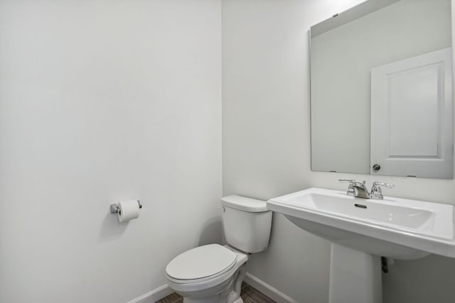 bathroom featuring toilet