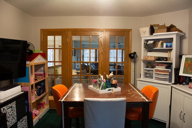 dining room featuring a textured ceiling