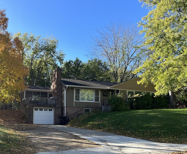 ranch-style home with a front yard and a garage