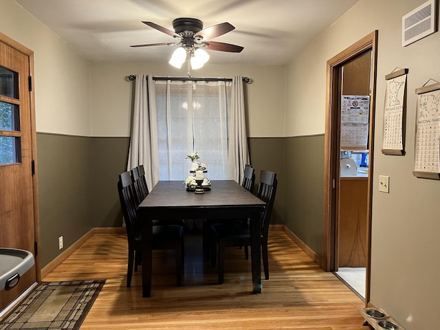 dining area featuring ceiling fan and light hardwood / wood-style flooring