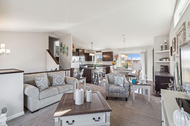 living room with lofted ceiling and light colored carpet