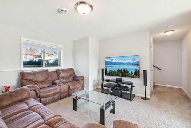 living room with a textured ceiling and light colored carpet