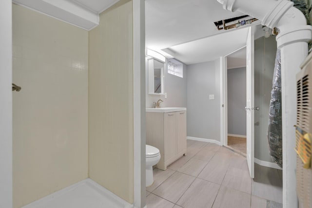 bathroom featuring vanity, tile patterned floors, toilet, and walk in shower