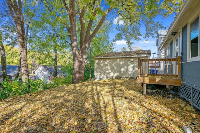 view of yard with a wooden deck