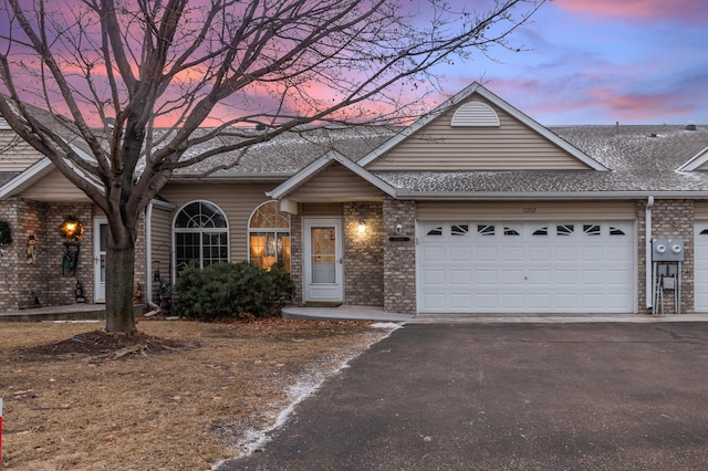 ranch-style house featuring a garage