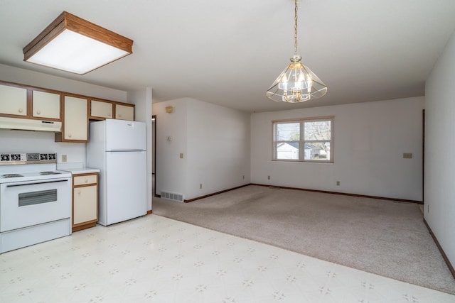 kitchen featuring pendant lighting, a notable chandelier, light colored carpet, and white appliances