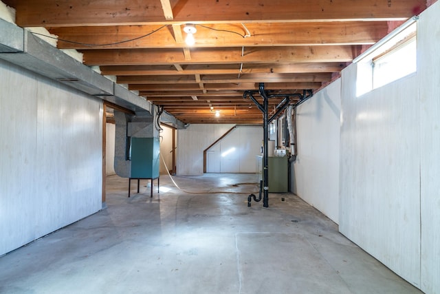 basement featuring heating unit