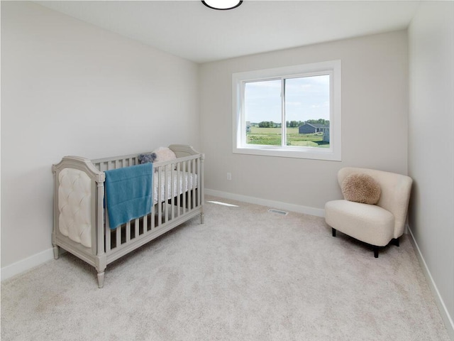bedroom with baseboards, visible vents, and carpet flooring