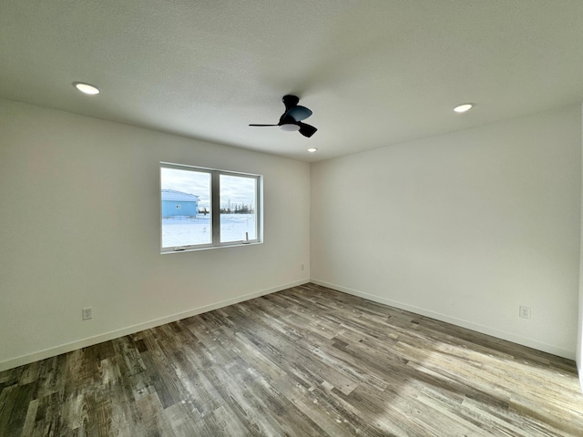 unfurnished room featuring ceiling fan and wood-type flooring