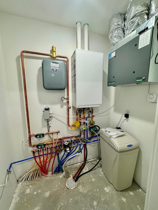 utility room featuring water heater