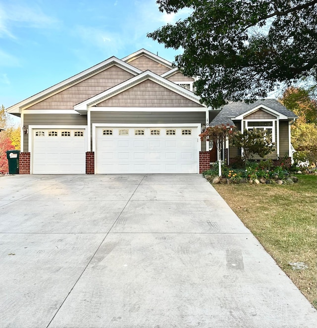 view of front of house with a front lawn and a garage