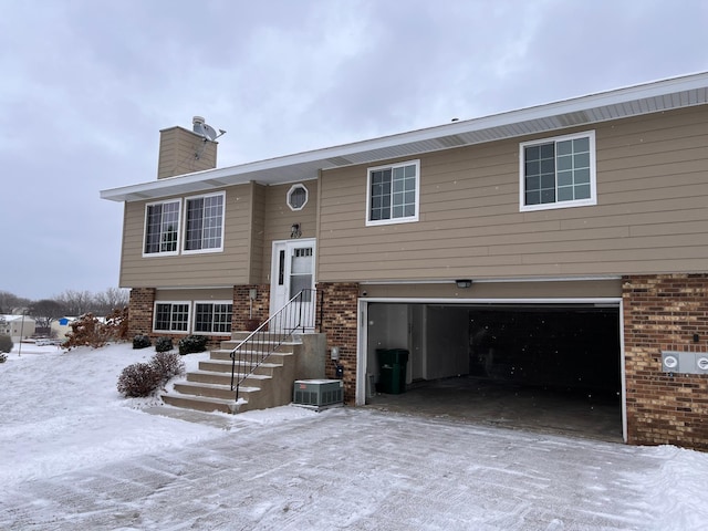 bi-level home featuring a garage