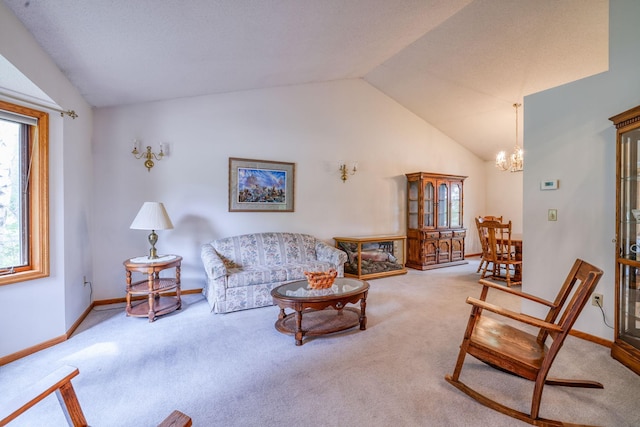 living room featuring carpet flooring, vaulted ceiling, and a chandelier