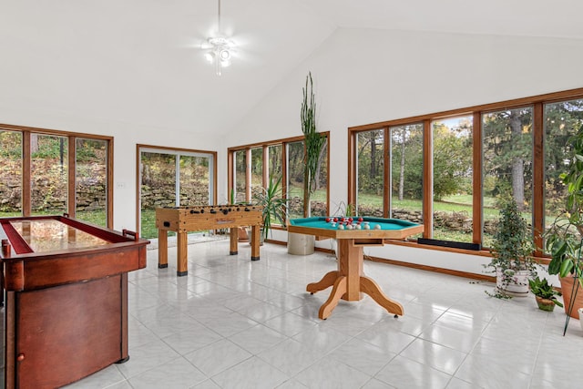 recreation room featuring pool table and high vaulted ceiling