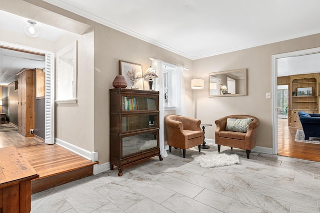 living area with baseboards, marble finish floor, and crown molding