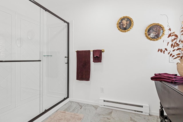bathroom with baseboards, marble finish floor, baseboard heating, and a stall shower