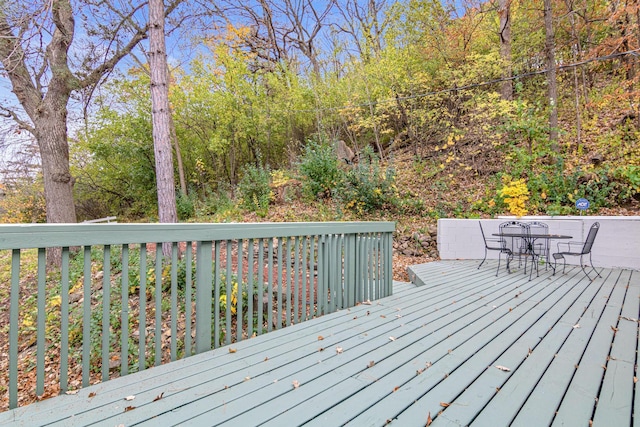 wooden deck featuring outdoor dining space