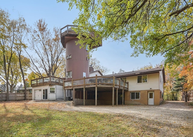 back of house with a lawn, a wooden deck, and cooling unit