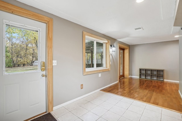 foyer with light hardwood / wood-style floors