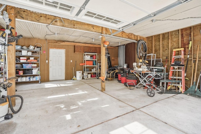 garage with wood walls