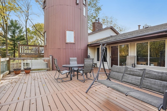 wooden terrace featuring an outdoor living space