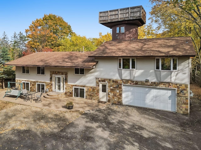 bi-level home with a patio area