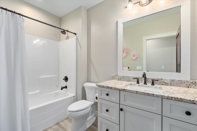 full bathroom with vanity, toilet, shower / bath combo with shower curtain, and wood-type flooring