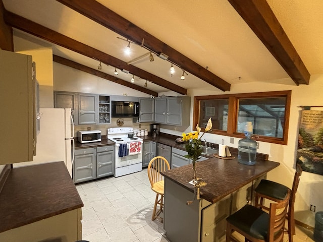 kitchen featuring gray cabinetry, white appliances, vaulted ceiling with beams, a kitchen bar, and kitchen peninsula