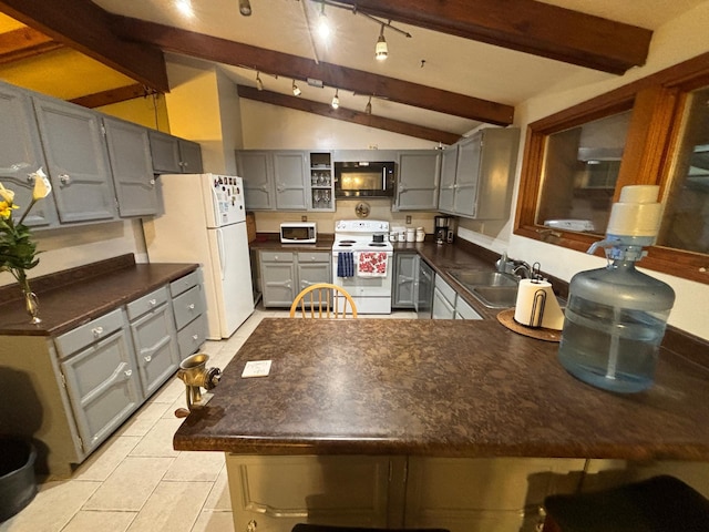 kitchen with kitchen peninsula, gray cabinetry, white appliances, sink, and vaulted ceiling with beams