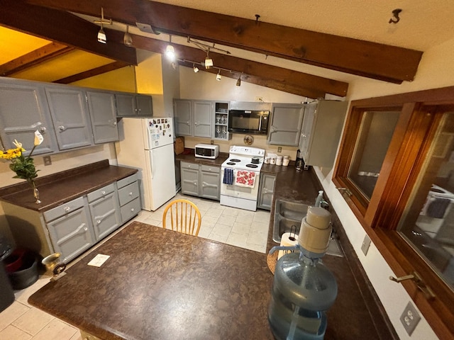 kitchen with vaulted ceiling with beams, white appliances, and gray cabinetry