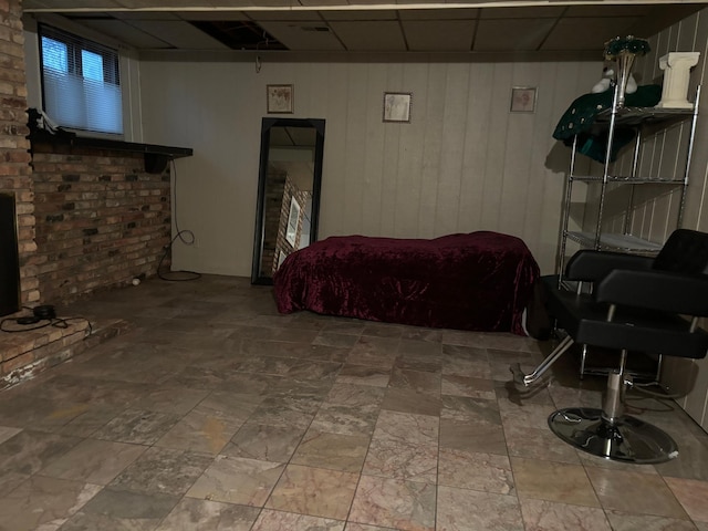 living room with wood walls