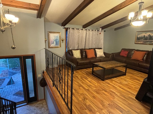 living room with beam ceiling, wood-type flooring, and an inviting chandelier